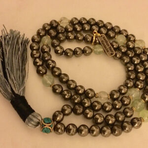 Golden Pyrite and Prehnite Mala Necklace featuring 108 hand-knotted beads, designed to activate the Solar Plexus and Heart Chakras. Perfect for Leo and Virgo, it promotes manifestation, protection, and emotional healing.