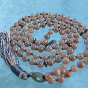  Strawberry Quartz Mala Necklace with 108 beads, featuring pink Strawberry Quartz for emotional healing and joy, finished with a tassel.