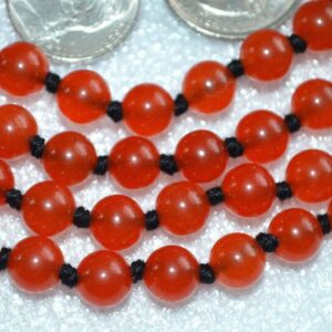 Red Jade Mala Necklace with 108 hand-knotted beads, designed to activate the Root and Heart Chakras. Ideal for Aries and Scorpio, enhancing courage and emotional balance. Perfect for meditation and spiritual growth.