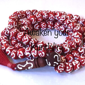 Om Beads Red Mala Necklace featuring 108 hand-knotted beads engraved with the sacred Om symbol, designed to balance the Heart and Crown Chakras. Ideal for Leo and Pisces, it promotes peace and spiritual connection.