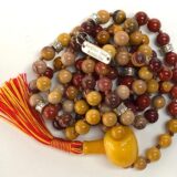 Mookaite Mala Necklace focusing on Root and Solar Plexus Chakras, providing grounding and inner strength. Ideal for Leo and Virgo, with hand-knotted Mookaite beads.