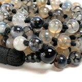 Dragon Vein Agate Mala Necklace featuring 108 hand-knotted beads, designed to activate the Root and Sacral Chakras. Perfect for Aries and Scorpio, it enhances grounding, creativity, and emotional balance.