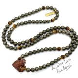 Carnelian, Pyrite & Tiger Eye Wrap Necklace featuring authentic beads designed to activate the Solar Plexus and Root Chakras. Ideal for Aries and Leo, it boosts vitality, confidence, and personal power.