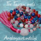 The Ultimate Taurus Mala Necklace made with Carnelian, Rhodonite, Rose Quartz, Red Coral, Jade, Lapis Lazuli, and Crystal Quartz beads. Hand-knotted with copper accents, it supports vitality, protection, and emotional healing. Ideal for Taurus.