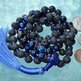 Blue Tiger Eye Mala Necklace with 108 hand-knotted beads, designed to activate the Throat and Third Eye Chakras. Ideal for Capricorn and Aquarius, enhancing clarity and communication. Perfect for meditation and spiritual growth.