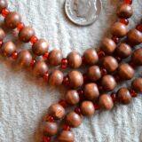 Bodhi Beads Buddhist Mala Necklace featuring 108 sacred beads, designed for meditation and spiritual enlightenment, supporting the Root Chakra and grounding energy.