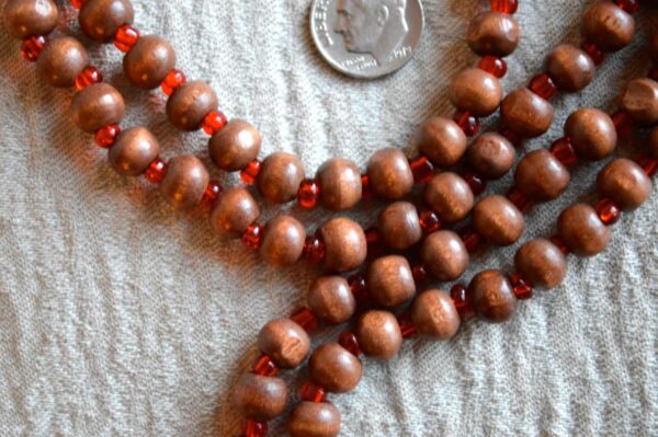 Bodhi Beads Buddhist Mala Necklace featuring 108 sacred beads, designed for meditation and spiritual enlightenment, supporting the Root Chakra and grounding energy.