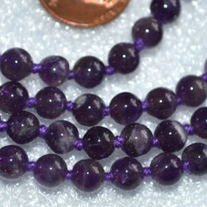 Amethyst Mala Necklace with 108 hand-knotted beads, designed to activate the Crown and Third Eye Chakras. Perfect for Pisces and Aquarius, enhancing spiritual awareness and intuition. Ideal for meditation and spiritual growth.