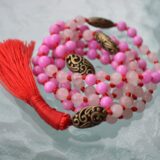 Rose Quartz Mala Necklace with soft pink beads, designed to promote love and emotional healing, aligned with the Heart Chakra, and ideal for Taurus and Libra signs.