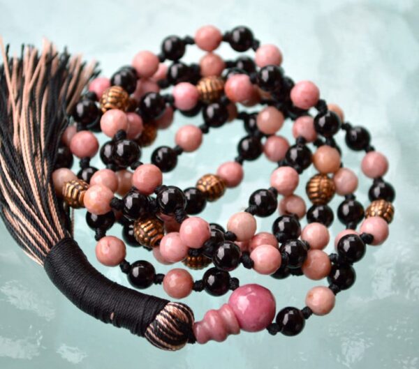 Rhodonite and Black Tourmaline Mala Necklace featuring soft pink and deep black beads, perfect for emotional healing and protection, aligned with Heart and Root Chakras.