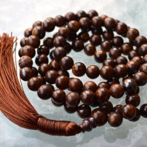 Bronzite Mala Necklace featuring 108 hand-knotted beads, designed to support the Root and Solar Plexus Chakras. Ideal for Capricorn and Libra, it promotes grounding, confidence, and emotional balance.