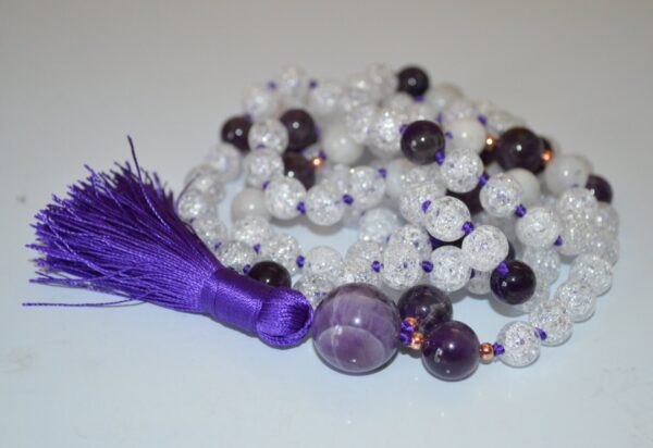 Crackled Quartz & Amethyst Mala Necklace featuring 108 hand-knotted beads, designed to enhance clarity and spiritual protection. Ideal for meditation and spiritual practices, aligning with the Crown and Third Eye Chakras, and resonating with Pisces and Aquarius.