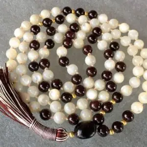  Mother of Pearl & Garnet Mala Necklace featuring genuine mother of pearl and garnet beads, designed for Sacral & Root Chakra balance, Capricorn & Aquarius empowerment, and enhanced emotional healing.