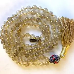 Golden Rutilated Crystal Quartz Mala Necklace with unique inclusions, designed for manifestation and abundance, supporting the Solar Plexus Chakra, associated with Leo and Taurus zodiac signs.