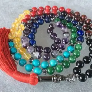 A Buddha Seven Chakra Knotted Beads Necklace featuring seven distinct beads, each representing one of the seven chakras, designed for universal balance and enlightenment.