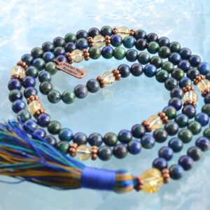 Hand-knotted Azurite & Citrine Mala Necklace featuring 108 beads, supporting Third Eye and Solar Plexus chakras, associated with Sagittarius and Leo, enhancing intuition and abundance.