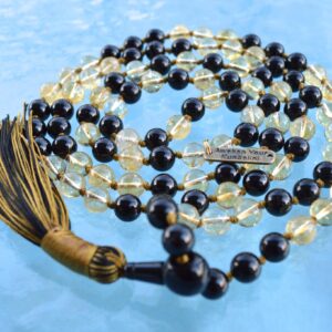  Black Tourmaline & Citrine Mala Necklace designed for Root and Solar Plexus Chakra healing, promoting protection, confidence, and abundance, resonating with Capricorn and Leo for stability and prosperity.