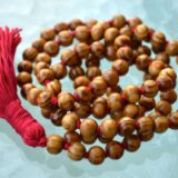 Wood Mala Bead Necklace, resonating with the Root Chakra, ideal for Capricorn and Taurus zodiac signs, promoting grounding and stability.