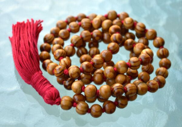 Wood Mala Bead Necklace, resonating with the Root Chakra, ideal for Capricorn and Taurus zodiac signs, promoting grounding and stability.