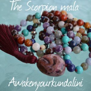 A striking Scorpio mala with red thread, featuring gemstones like Malachite, Jasper, Agate, Hematite, and more, symbolizing transformation, protection, and spiritual growth.