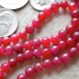 Red Jade Mala Necklace featuring 108 hand-knotted beads designed for strength, passion, and vitality. Resonates with Aries and Scorpio zodiac signs.