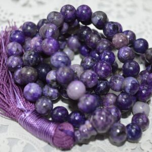 Charoite Mala Necklace with 108 beads, purple guru bead, and tassel, symbolizing transformation and spiritual insight.