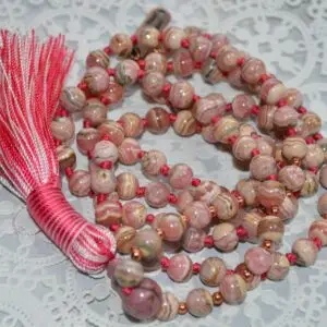 Rhodochrosite Knotted Mala Bead Necklace designed for Heart Chakra support, offering love and emotional healing, with gemstones resonating with Scorpio and Leo.