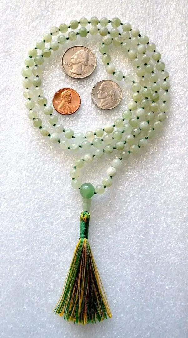 A Green Aventurine Knotted Necklace featuring genuine green aventurine beads, associated with the Heart Chakra and Libra zodiac sign, promoting harmony and healing.