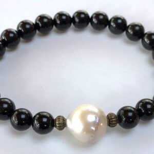 Pearl & Black Tourmaline Bracelet for Gemini sun sign, featuring root and crown chakra grounding and protective benefits