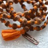 Tulsi Mala Beads Necklace featuring genuine Tulsi wood beads, designed for Root and Heart Chakra balance and spiritual purification.