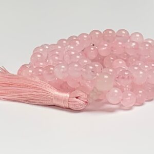 Rose Quartz Mala Necklace featuring 108 hand-knotted Rose Quartz beads, designed to promote love, compassion, and emotional healing. Ideal for meditation and spiritual practices, aligning with the Heart Chakra, and resonating with Taurus and Libra.