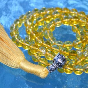 Citrine Mala Necklace featuring 108 hand-knotted Citrine beads, designed for abundance, confidence, and manifesting success. Aligns with the Solar Plexus Chakra and resonates with Aries and Gemini. Ideal for meditation and daily positivity.