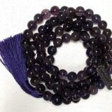 Dark Amethyst Mala Necklace featuring 108 hand-knotted beads, designed to activate the Third Eye and Crown Chakras for intuition and clarity, associated with Aquarius and Pisces.