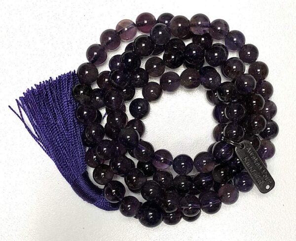 Dark Amethyst Mala Necklace featuring 108 hand-knotted beads, designed to activate the Third Eye and Crown Chakras for intuition and clarity, associated with Aquarius and Pisces.