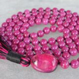 Majenta Mashan Mala Necklace featuring 108 hand-knotted Magenta Mashan jade beads, designed for balance and spiritual connection. Ideal for meditation and spiritual practices, aligning with the Root and Crown Chakras, and resonating with Scorpio and Capricorn.