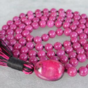 Majenta Mashan Mala Necklace featuring 108 hand-knotted Magenta Mashan jade beads, designed for balance and spiritual connection. Ideal for meditation and spiritual practices, aligning with the Root and Crown Chakras, and resonating with Scorpio and Capricorn.