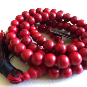 Red Howlite Mala Necklace featuring 108 hand-knotted Red Howlite beads, designed for calming and grounding energy. Aligns with the Root Chakra and resonates with Aries and Scorpio. Ideal for meditation and stress relief.