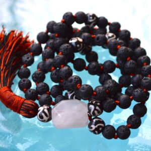 KALI Lava Mala Necklace featuring 108 hand-knotted lava beads, designed to activate the Root Chakra for strength and protection, associated with Scorpio and Capricorn.