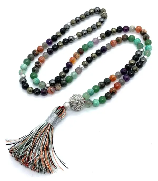 A Protection Crystals Mala Beads Necklace featuring smooth, authentic black tourmaline, fluorite, and amazonite beads, with a Parad (Mercury) guru bead. The mala is hand-knotted between each bead for durability and finished with a beautifully crafted tassel. It supports the Root and Solar Plexus Chakras, offering EMF protection, grounding, and psychic shielding.