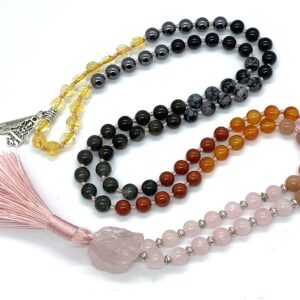 Rose Quartz & Carnelian Mala Necklace with 108 beads, copper guru bead, and black tassel, promoting emotional healing and vitality.