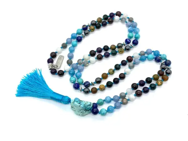 The Ultimate Aquarius Mala Necklace featuring high-quality gemstones, designed for Crown & Third Eye Chakra balance, January birthstone, and enhanced spiritual clarity and intuition.