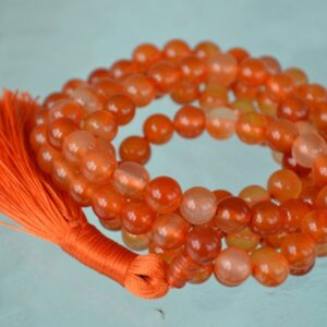 Handcrafted Carnelian Mala Necklace with 108 vibrant orange beads, designed to enhance courage, motivation, and creativity, aligned with the Root and Sacral Chakra