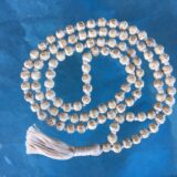 Hare Rama Tulsi Mala featuring inscribed beads, aligning with the Heart Chakra, fostering devotion and spiritual growth, handcrafted in the USA.