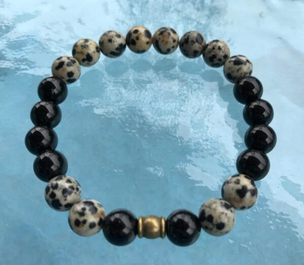  Genuine Black Tourmaline & Dalmatian Mala Bracelet designed for spiritual protection, grounding, and meditation, featuring natural gemstone beads associated with the Root Chakra and October birthstone.