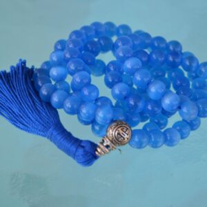 A Blue Cat's Eye Beads Mala Necklace designed for Throat Chakra alignment, resonating with Gemini and Aquarius energies, enhancing communication and mental clarity.