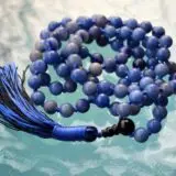 cA Blue Aventurine Mala Necklace with 108 beads, associated with the Throat Chakra, designed for Gemini zodiac signs, promoting communication and clarity.