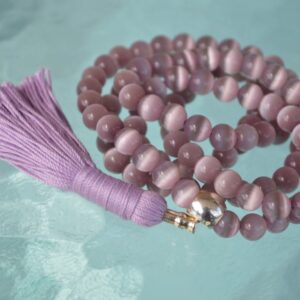 Purple Cat's Eye Mala Necklace featuring 108 hand-knotted beads, designed to activate the Third Eye Chakra for intuition and protection, associated with Sagittarius and Capricorn.