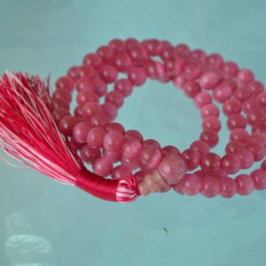 A vibrant Magenta Cat's Eye Mala Beads Necklace designed to enhance emotional balance, focus, and positivity, with 108 beads hand-made for durability and comfort.