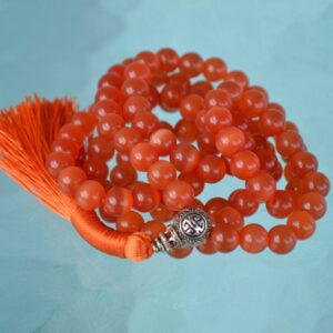 An Orange Cat's Eye Beads Mala Necklace designed to enhance creativity, confidence, and emotional balance, with a handcrafted and elegant design.