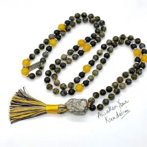 A Blue Llanite Opal Mala Beads Necklace featuring smooth, authentic blue llanite opal beads. The necklace is hand-knotted between each bead for durability and finished with a beautifully crafted tassel. It supports the Throat Chakra, enhancing communication, clarity, and personal expression, resonating with the qualities of Aquarius.